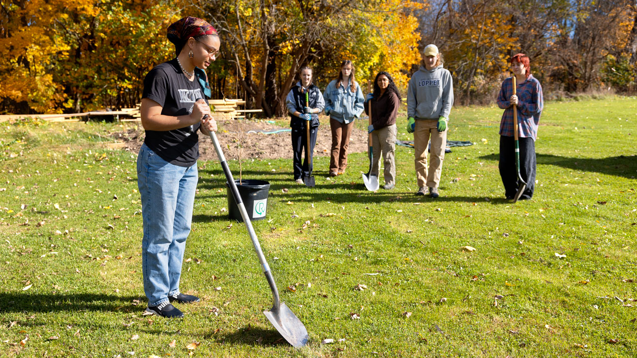 student using shovel in garden